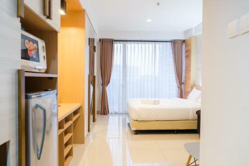 Comfy Studio At Dago Suites Apartment By Travelio