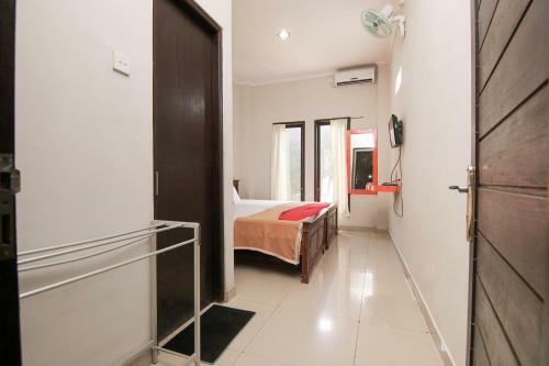 Hostal Reddoorz Plus Near Ubung Terminal Denpasar