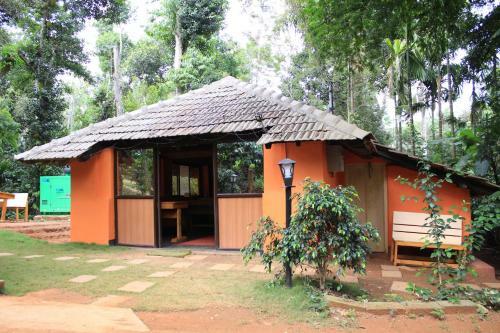Oyo 26892 Coorg Amodhini Wood Cottage Suits