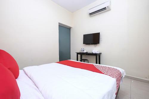 Hostal Oyo 89493 Q Hotel