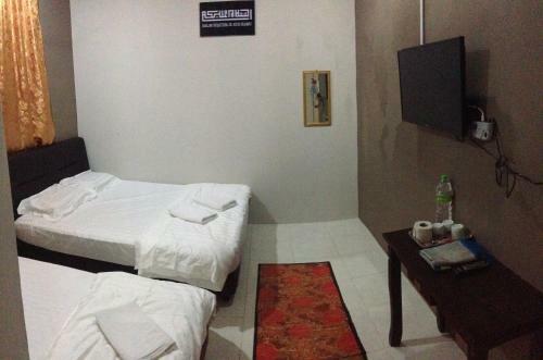 Hostal Anggun Beach Guest House
