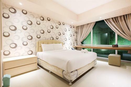 Dazzle Studio Room @ U-residence Apartment By Travelio