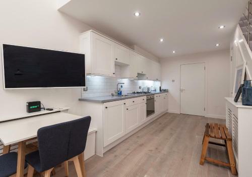 Apartamento The Broughton Mews Residence