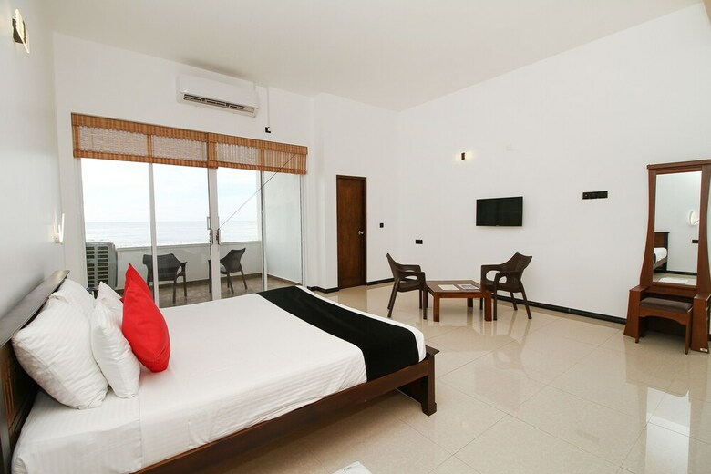 Hotel Capital O 311 Grace Beach Resort