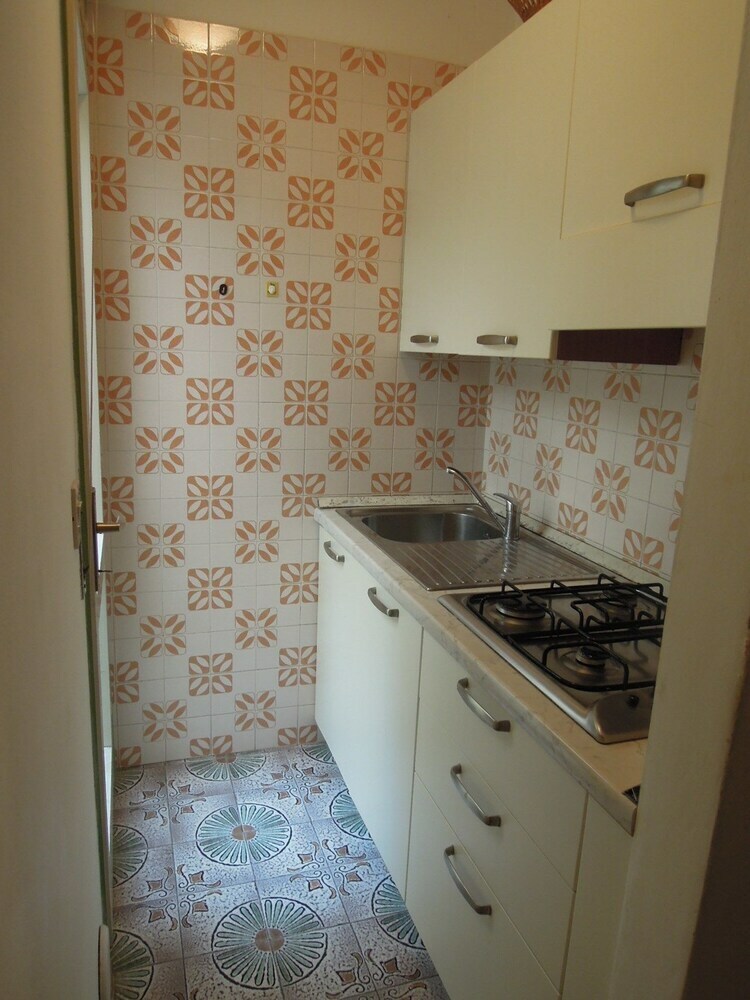 Apartamento Villaggio Olimpia