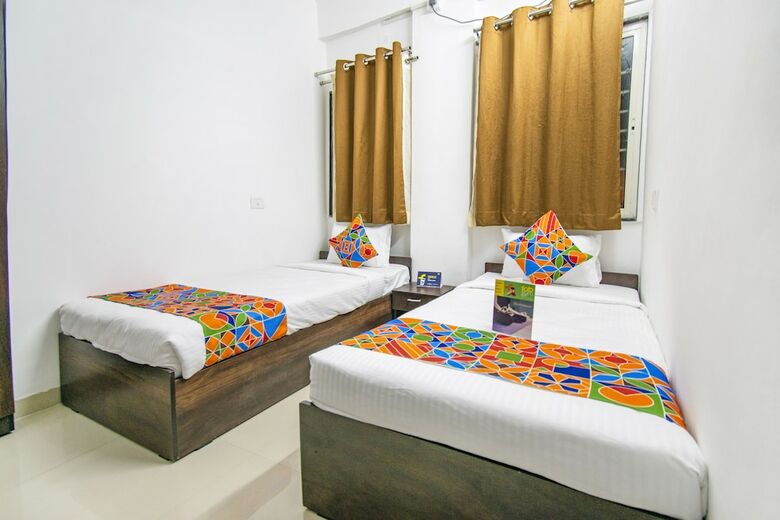 Fabhotel Purple Orchid