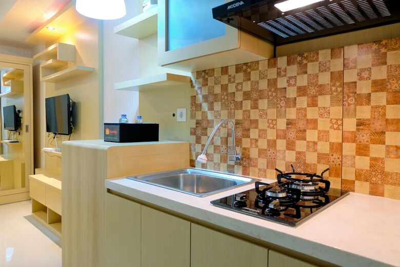 Homey Studio Apartment At Grand Kamala Lagoon