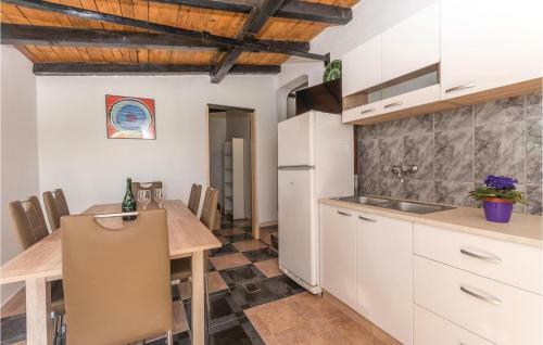 Three-bedroom Holiday Home In Tkon