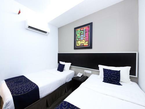 Capital O 978 Midaris Hotel