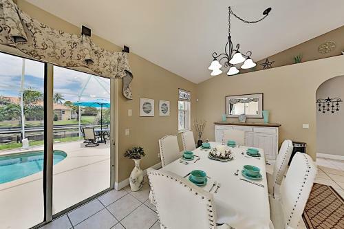 Canalfront Beauty With Private Heated Pool & Garage Home