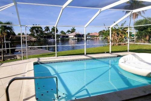 Canal-front Getaway With Heated Pool & Dock Home
