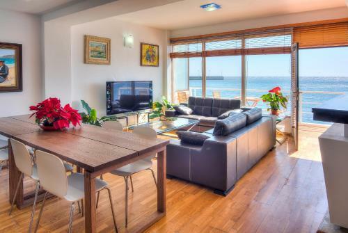 House Touching The Sea