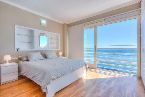 House Touching The Sea