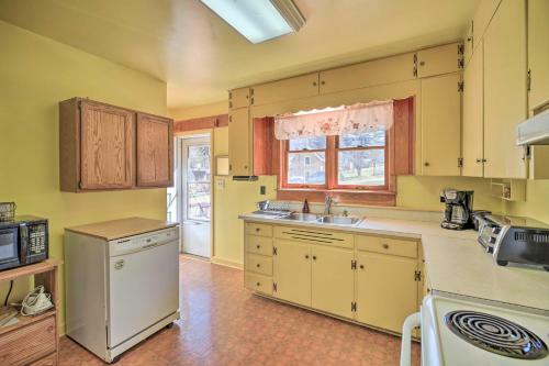 Quaint Creekside Home With Spacious Deck And Yard