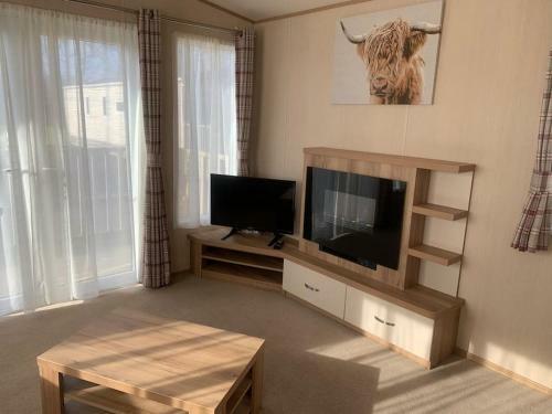 Woodpecker Lodge, Camelot Holiday Park, Ca6 5sz