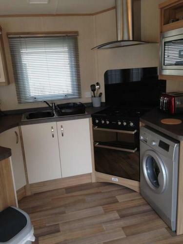 Woodpecker Lodge, Camelot Holiday Park, Ca6 5sz