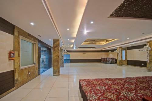 Capital O 91036 Hotel Stanza