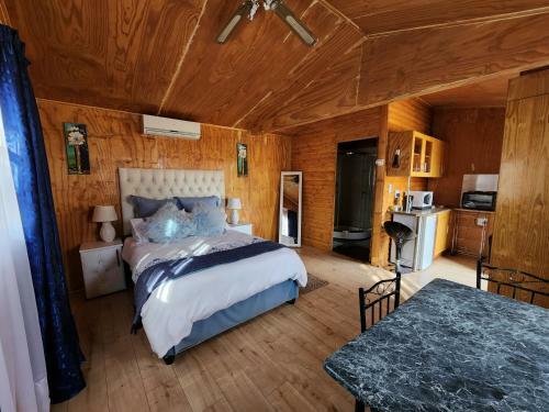The Log Cabin Apartments Hotel
