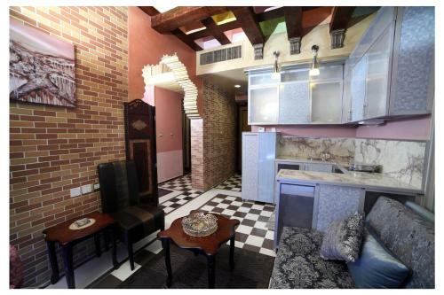 Apartamento Roomi Suites Hotel