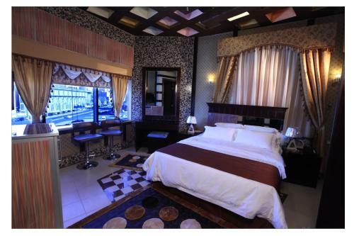 Apartamento Roomi Suites Hotel