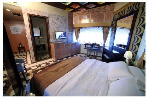 Apartamento Roomi Suites Hotel
