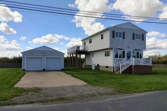 Waterfront Home With Large Deck And Dock On Narrow Bay