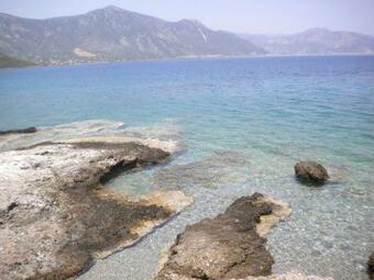 Amygdalia, A Stone House In A Quiet Landscape