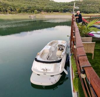 Houseboat-yacht Nestled In A Lake Travis Cove